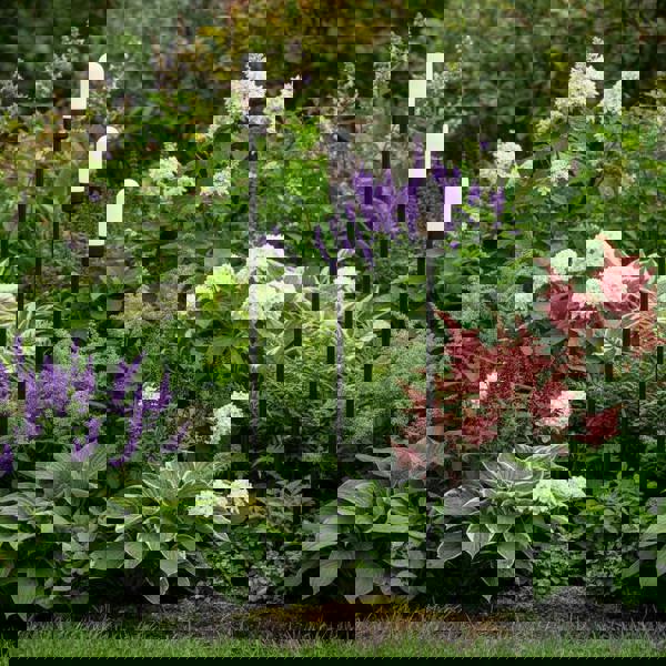 black garden spike light IP65 spiked into a garden border