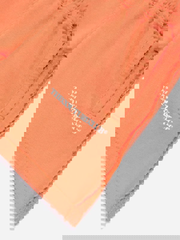 The Couture Club Kids Raw Seam Shorts in Orange