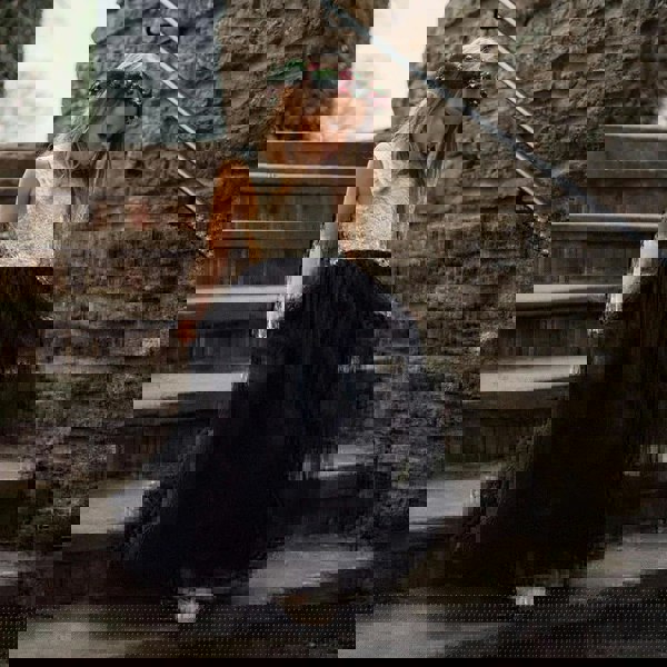 young flower girl walking down stairs in Bohemian Classic Dress - Black