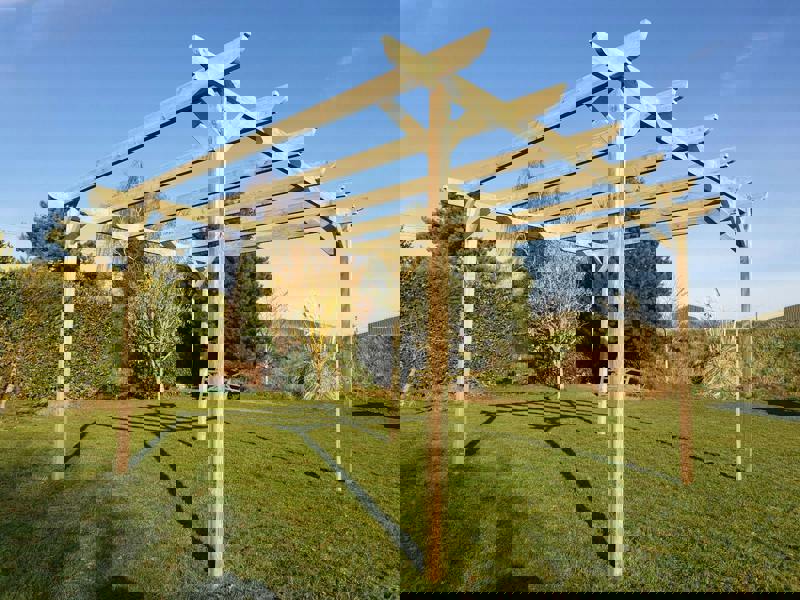 Corbel wooden garden pergola kit made from high quality timber posts and beams, featuring smooth angled edges and an open frame design suitable for patios, gardens, and outdoor seating areas.