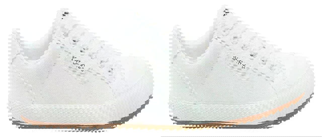 Rocket Dog Cheery Low Womens Casual Lace Up Canvas Shoes Trainers, white canvas sneaker with lace-up front and rubber sole.