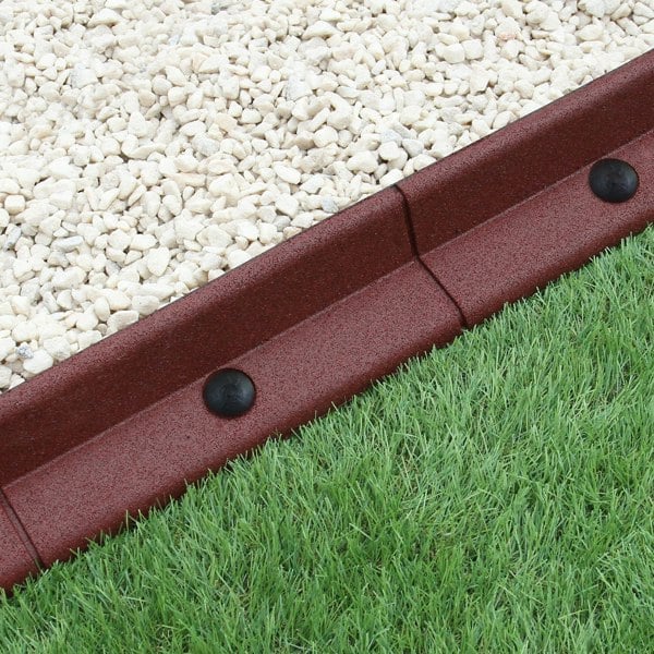 Flexible terracotta lawn edging, 1.2m long, featuring a textured finish, contrasting with gravel and lush green grass