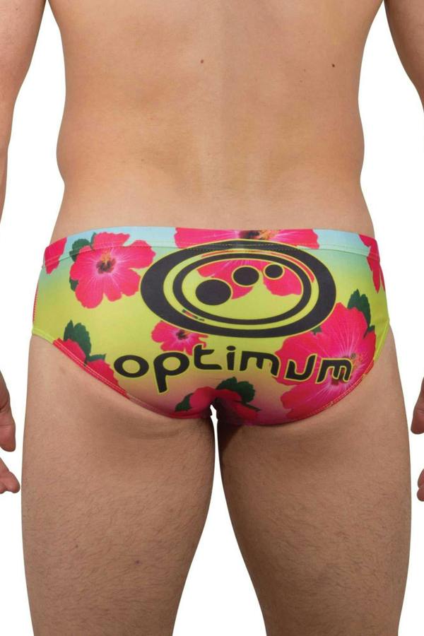 Optimum Tackle Trunks swim brief in neon hibiscus floral print, rear view on male model with black Optimum logo - Optimum