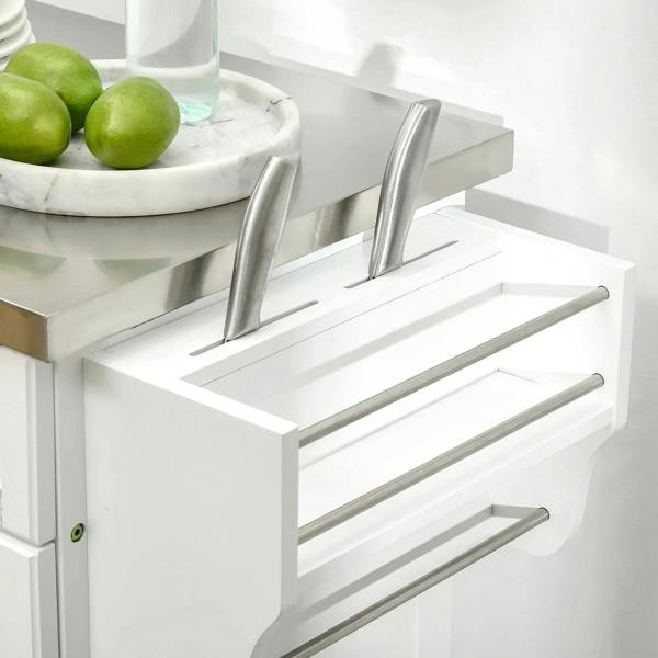 Open drawer with stainless handles and utensil rail on white kitchen island cart