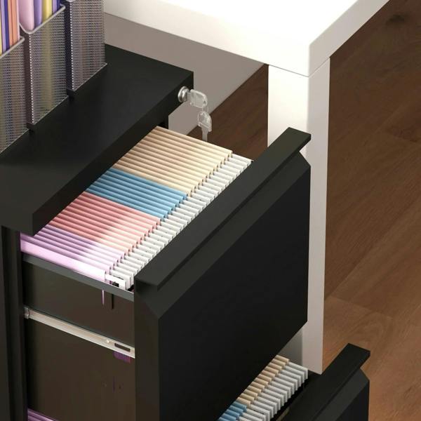 Open drawer of a black steel filing cabinet holding hanging file folders
