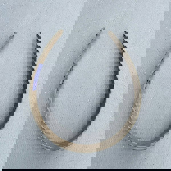 Beige hairband, smooth satin fabric, minimalist plain design, soft matte finish, structured slim style, versatile everyday accessory
