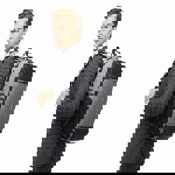 Man in a suit with a gray and black best travel laptop backpack multi-functional on a white background