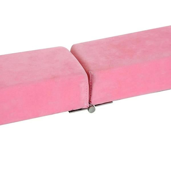 Pink foam balance beam corner with stitched padding and protective end cap.