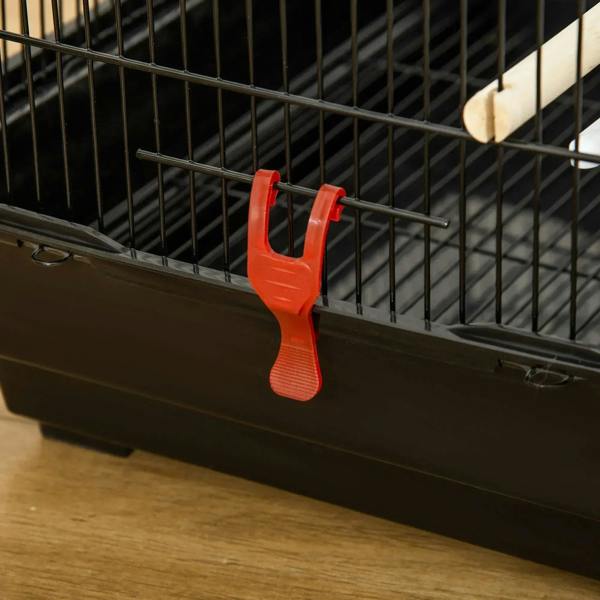 Bird cage slide tray latch with orange clip on black base