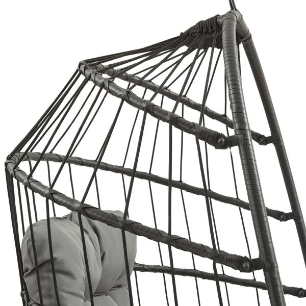 Black rattan hanging egg chair featuring a woven design, sturdy frame, and soft gray cushion for comfort and style