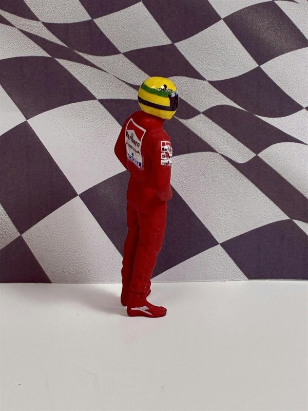 a toy figure in red uniform