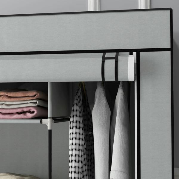 Dark grey fabric wardrobe interior with hanging clothes and folded storage on shelves