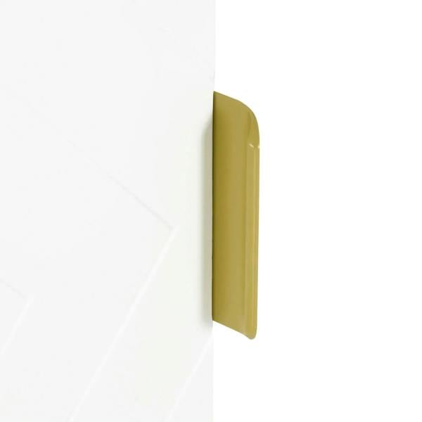 White cabinet door panel with gold bar handle and geometric embossed pattern.