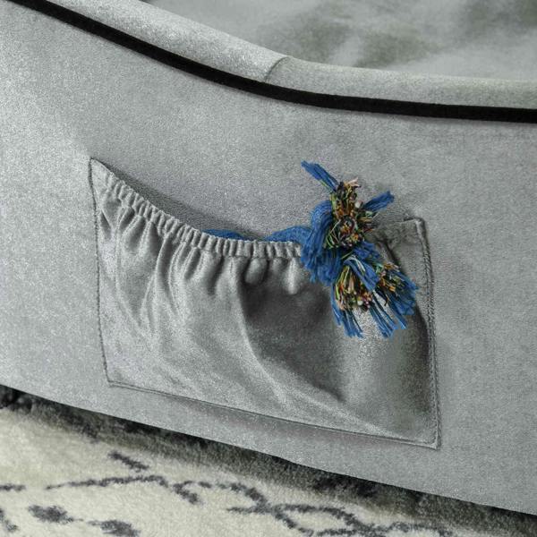 Grey removable cushion cover with drawstring opening and decorative tassel