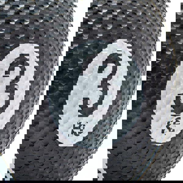 Black medicine ball with a white label displaying '3 KG' on a white background