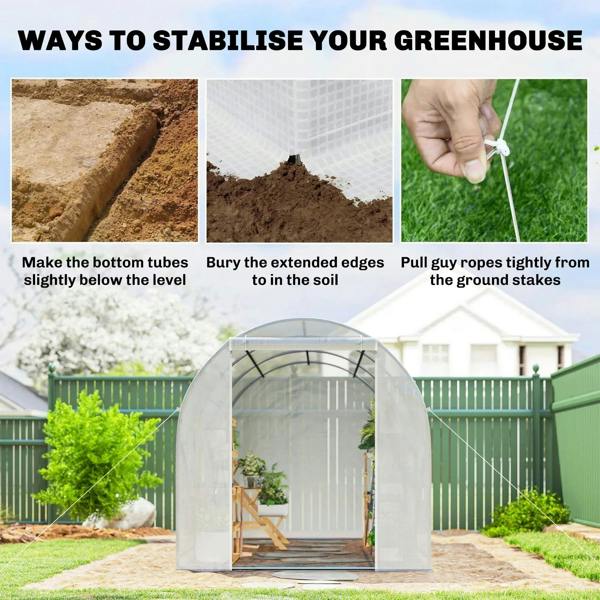 White polytunnel greenhouse on stone base with side ground anchoring points