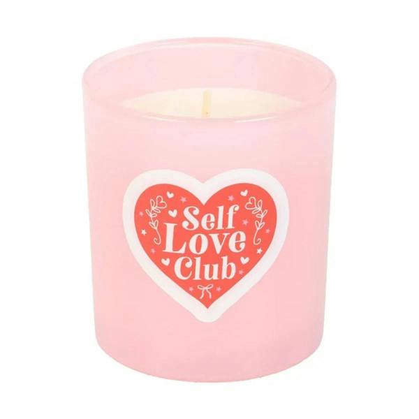 Pink coconut scented candle jar with Self Love Club heart logo and lit wick