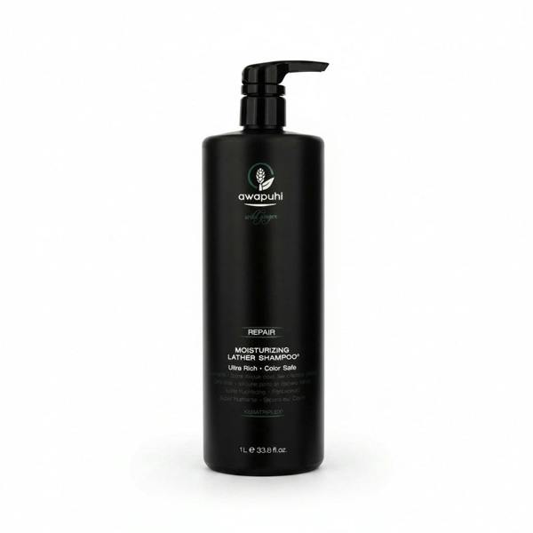 Black shampoo bottle with pump labeled 'awapuhi' on a white background
