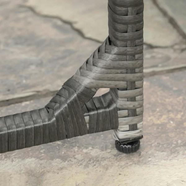 Close-up of grey rattan chair leg and base with woven joint detail
