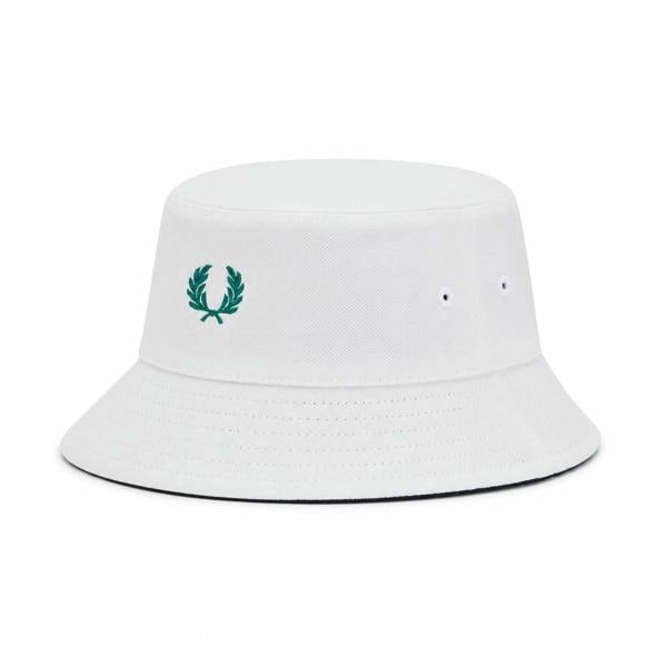 Fred Perry reversible piqué bucket hat in snow white with green laurel wreath logo.