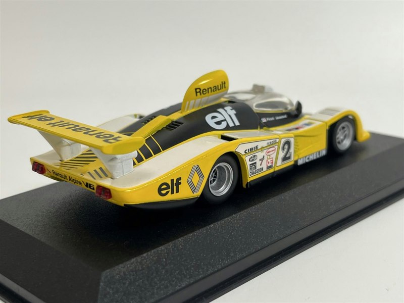 a yellow and white toy race car