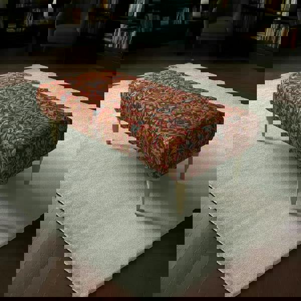 Premium Lounge Seating Ottoman with vibrant multi-toned designer fabric and sleek wooden legs