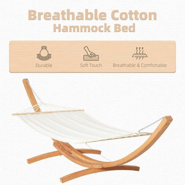 White cotton hammock swing with wooden arched stand and hanging ropes