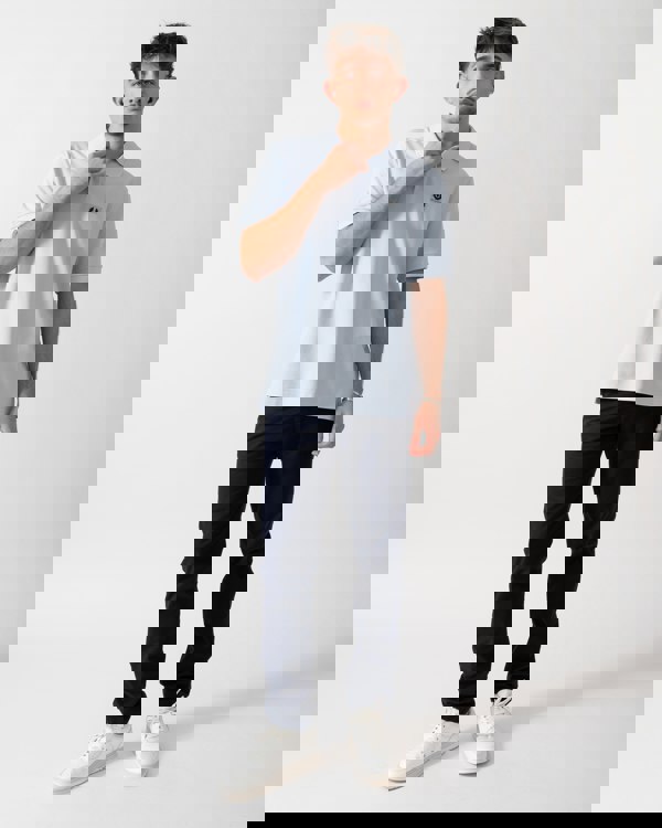 Full length of a Model wearing a Belstaff Short Sleeved Mens Polo in Sky Blue