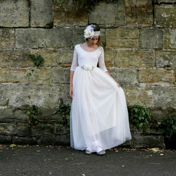 Girls looking at floor wearing dress