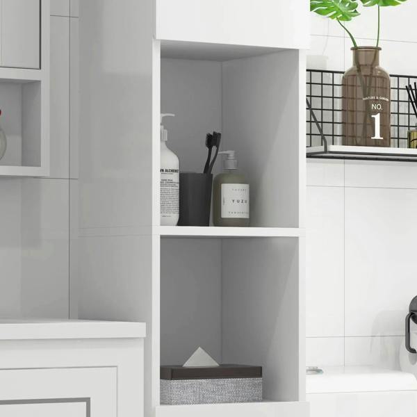 White bathroom cabinet interior with open shelves holding bottles and a folded cloth