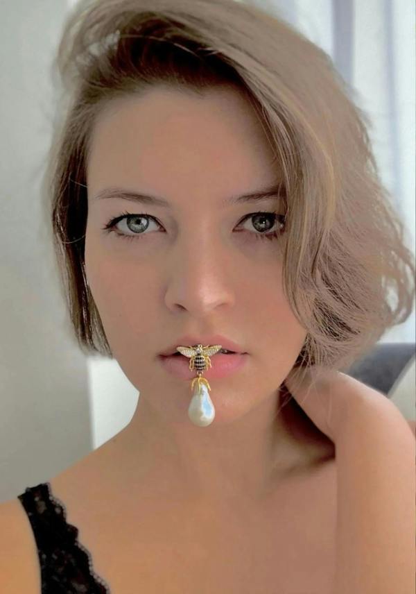 The earring worn by a model.