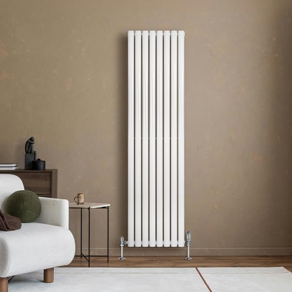 Sleek white oval single column radiator with valves, 1800mm x 480mm, mounted on a textured brown wall in a modern living space