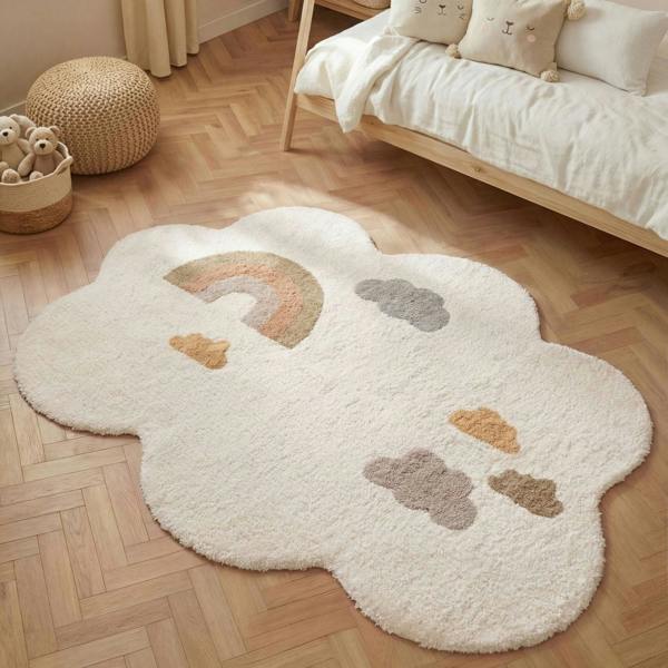 Cloud-shaped rug with rainbow and cloud patterns on a wooden floor.