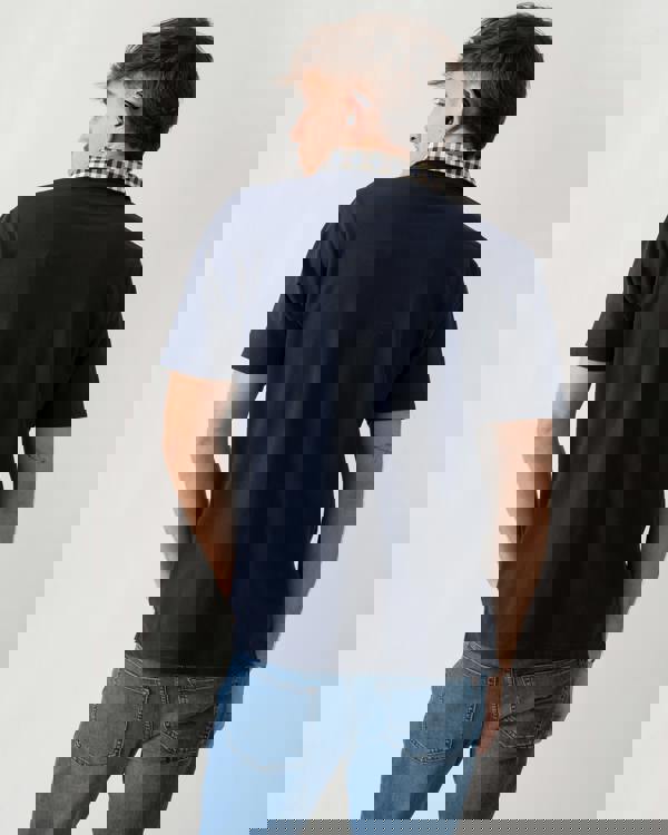 back shot of a model wearing an Aquascutum Mens Club Check Collar Polo Shirt in Navy 11