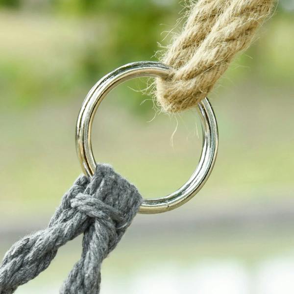 Dark grey braided rope attached to a metal hanging ring for macrame hammock suspension