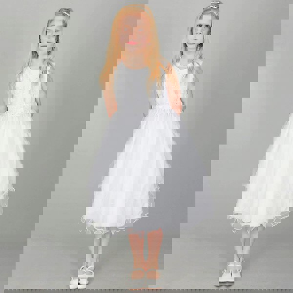 Girl wearing white Tiffany Flower Girl dress