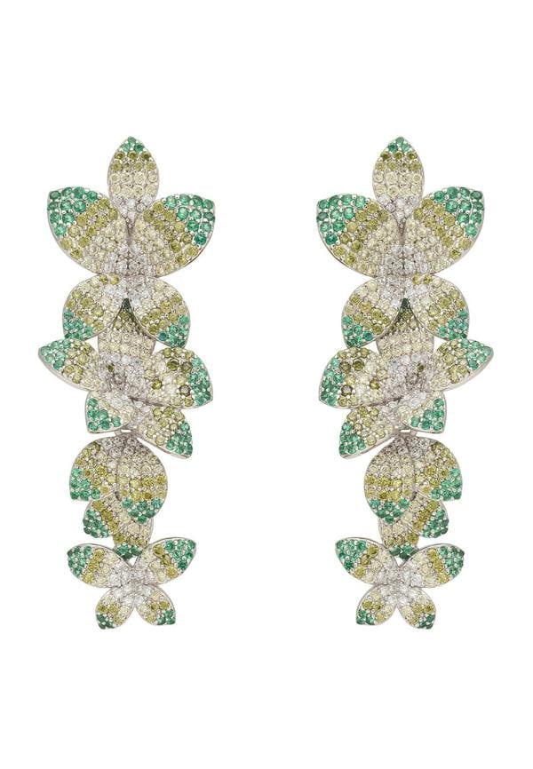 Pair of flower-shaped earrings with green and white stones on a white background