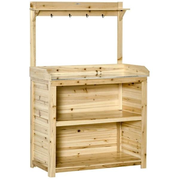 Natural wood potting bench with lower shelves and hanging hooks under the top rail.