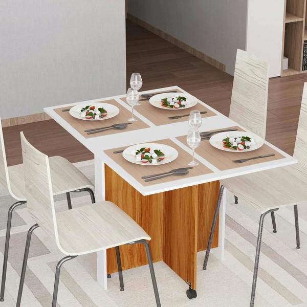 White folding dining table with teak wood sides and caster wheels, set with plates