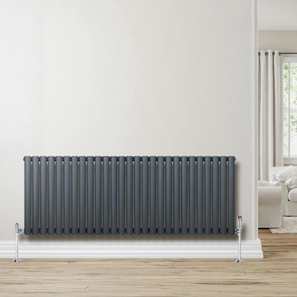 Oval single column radiator in anthracite grey, 600mm x 1620mm, featuring sleek vertical lines and polished valves, set against a light wall