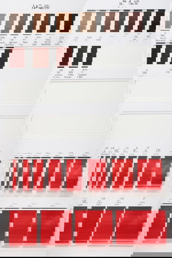 Color swatch chart with red ribbons and text on a white background