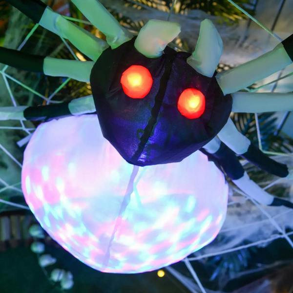 Inflatable spider close-up with red LED eyes and bright iridescent LED belly