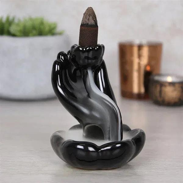 Glazed black hand backflow incense burner with standing cone holder and shallow tray base