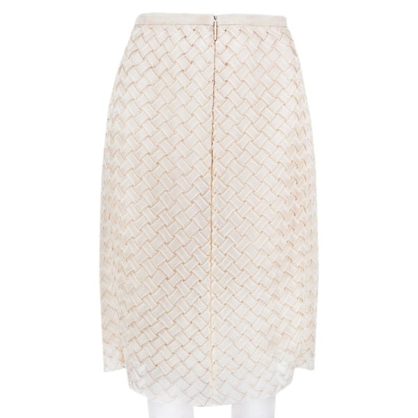 A Christopher Kane pencil skirt which is intricately shaped to appear woven