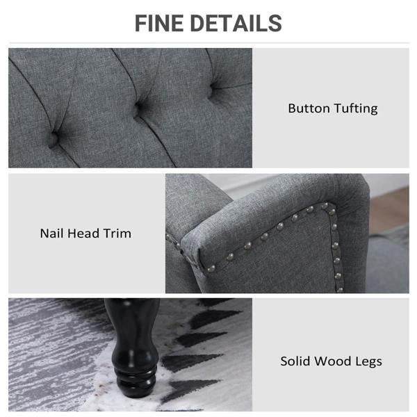 Light gray recliner armchair with nailhead trim, button tufting, and solid wood legs
