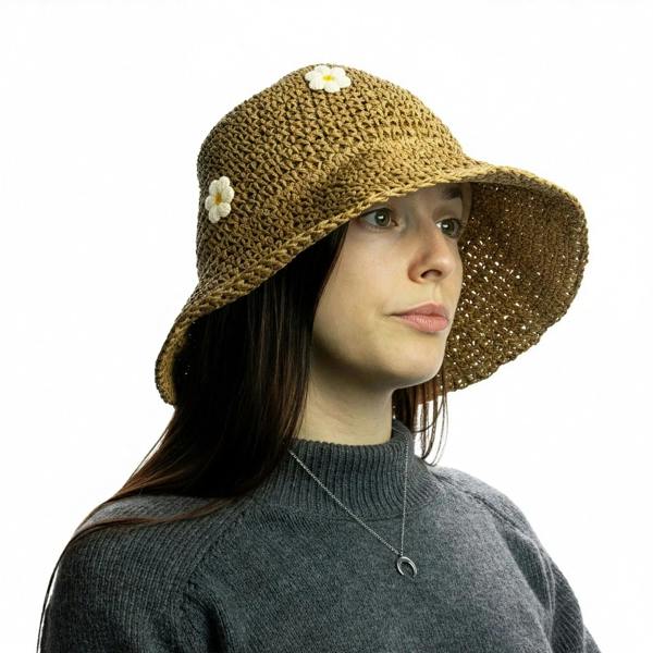 Floppy straw sun hat in dark tan with small white daisy appliques on the crown