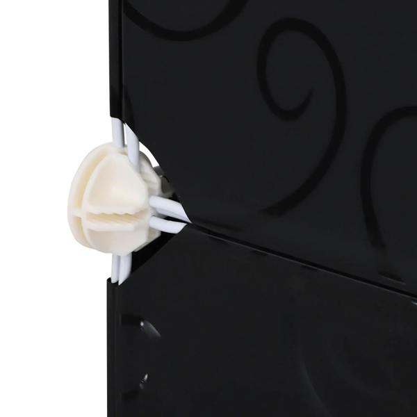 Close-up of connector clip securing black panel to white frame posts