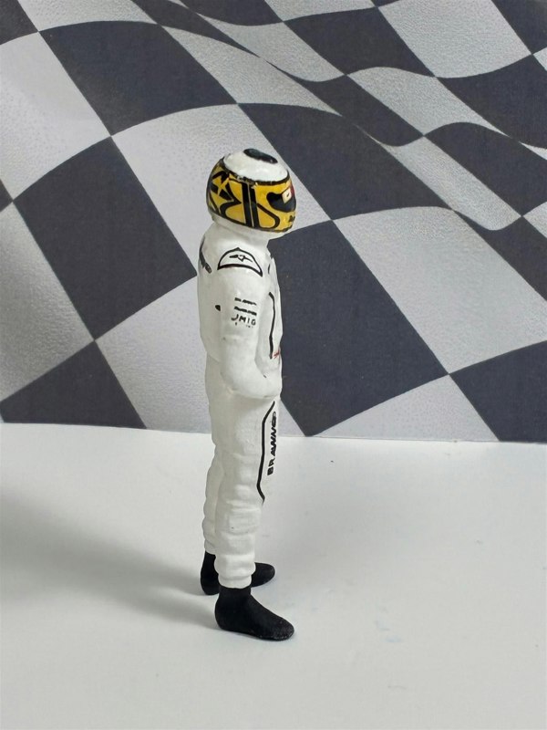 a toy figure of a man wearing a helmet