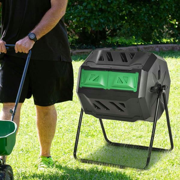 Black rotating dual-chamber composter with green front doors on outdoor grass