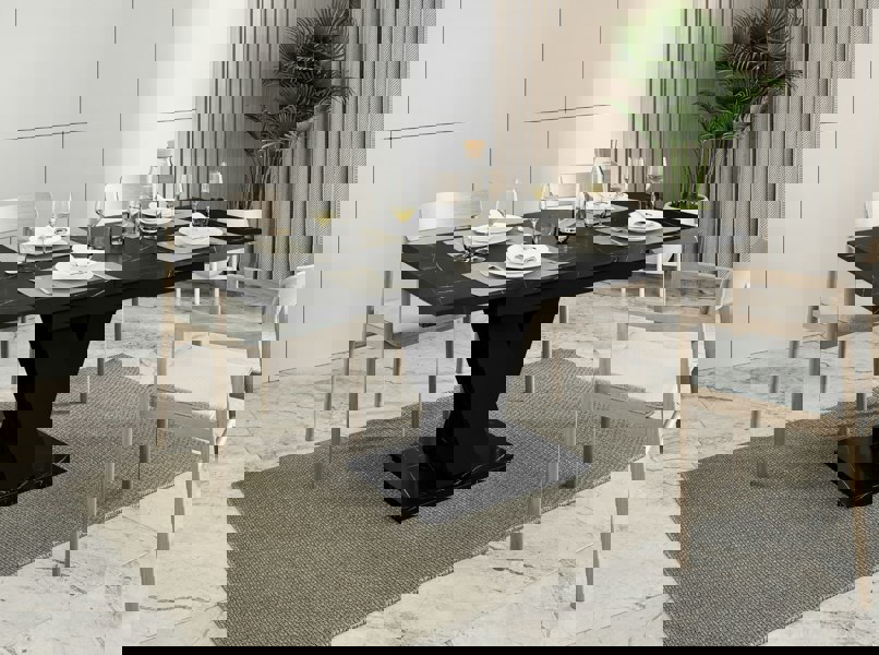 Extendable MASIV dinner table in black royal marble with solid black base.